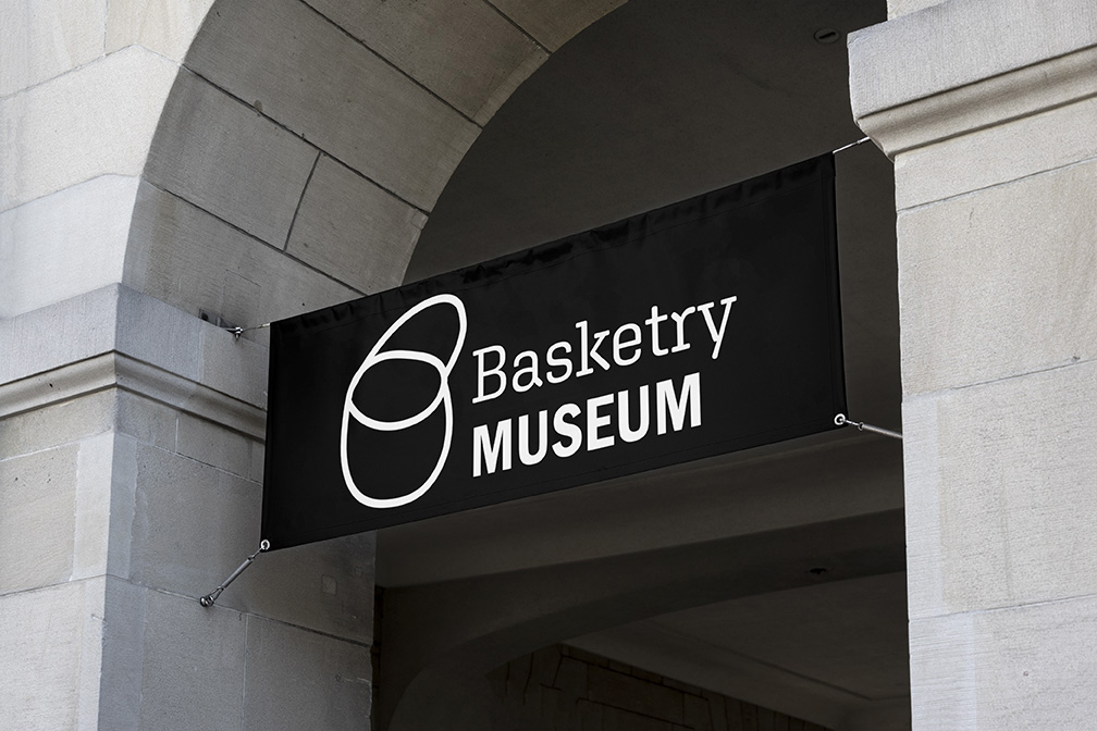 Black Basketry museum banner in building archway